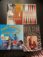 All four books shown flat on a table: Barney Hall's Tales from Trackside, Backgammon of Today, Married to a Rock Star, Dave Barry's Guide to Life