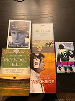 Photo of five sports-themed books on a table showing titles and cover images.