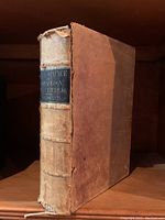 Front spine and cover of the antique book showing worn hardcover binding with brown boards and cloth spine. Label on spine reads 'Human Science or Phenology O. S. Fowler'.