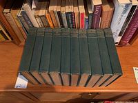 Photo of 10 vintage hardcover books, 9 by Balzac in green cloth with gilt titles, and 1 by Kant, showing condition and spine titles.