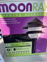 Front view of MoonRays Evening Accents 10-light set box with product details indicating low voltage landscape lighting and 4 watt brightness.