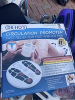 Front view of Dr. Ho's Circulation Promoter box showing the device image, uses, and benefits for foot and leg pain relief.