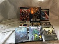 Photo showing arrangement of DVDs including The OC, Greatest Showman steel case, Star Wars and more