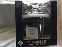 Front view of boxed NHL ice bucket set with visible Toronto Maple Leafs logo on the bucket through the packaging.