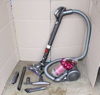 Overview of vacuum, hose, floor head and all attachments laid out