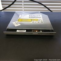 Front and top views of slim Samsung HP TS-LB23L SATA Blu-ray BD-ROM DVD writer laptop drive with Lightscribe.