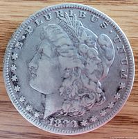 Obverse side of the 1880 Morgan silver dollar coin showing Lady Liberty and the date 1880.