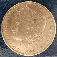 Obverse side of the 1885 Morgan Silver Dollar showing Lady Liberty profile and the year 1885.
