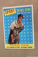 Front of 1958 Warren Spahn baseball card showing player image and star background with identifying text