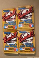Four sealed 1987 Donruss Baseball wax packs displayed on front side showing branding, puzzle, and card information.