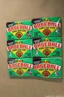 Front view of six sealed 1989 Bowman Baseball Comeback Edition wax packs with orange, green, and white packaging showing brand and bubble gum inclusion.