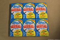 Front view showing six 1989 Topps Major League Baseball wax packs, each with colorful promotional print.