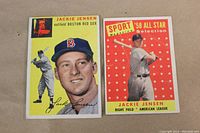 Front view of two Jackie Jensen baseball cards from 1954 and 1958, showing player portraits and design details.