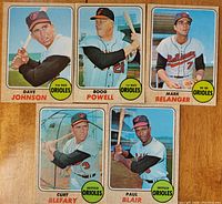 Fronts of five 1968 Topps Baltimore Orioles baseball cards featuring players Dave Johnson, Boog Powell, Mark Belanger, Curt Blefary, and Paul Blair posing with bats.