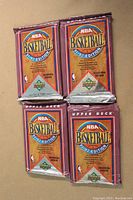 Four 1991-92 Upper Deck NBA basketball trading card foil packs arranged in a 2x2 grid showing the front of the packs, all sealed.
