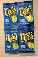 Front of four 1992-1993 Fleer Ultra Hockey card packs, two Series 1 and two Series 2 packs, blue foil with yellow and red foil branding.