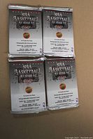 Four unopened 1992-93 Upper Deck NBA Basketball holographic foil packs stacked in a 2x2 layout showing the front.