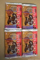 Four sealed foil packs of 1992-93 Upper Deck Series 2 basketball cards, front view showing basketball player graphic and branding