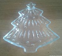 Top view of the crystal Christmas tree serving dish showing its shape, clear crystal material, and textured details.