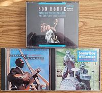 Top view of three CDs: Son House double CD, Muddy Waters single CD, Sonny Boy Williamson single CD.
