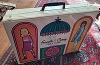 Exterior view of the closed vintage Francie & Casey doll case showing colorful illustrations and handle.