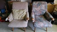Both chairs side by side showing different upholstery and wood frame.