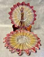 Pair of Sommerso style glass serving trays with ruffled edges, viewed from above to show color gradient and shape.