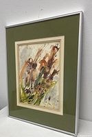 Framed view of the floral watercolor painting showing front, green mat and silver frame.