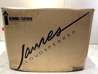 Front of sealed box showing James Loudspeaker logo and EMB-1200 model label