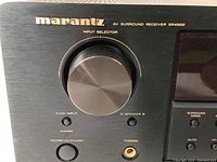 Front left view showing Marantz logo, input selector knob, power button and headphone jack.