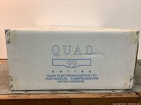 Front of sealed carton labeled QUAD 99 series