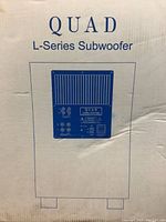 Front of box with QUAD L-Series Subwoofer branding and rear panel illustration