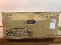 Front of box showing Sherbourn branding, model PT-7010A Pre/Pro/Tuner and 120V selection