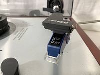 Close-up of Thorens headshell and installed Blue Point cartridge.