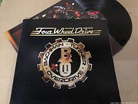 Gatefold vinyl LP titled 'Four Wheel Drive' by Bachman-Turner Overdrive with record visible and album cover clean and intact.