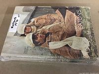 Front cover of Eaton's 1970 catalog book with two men in brown coats and white scarves.