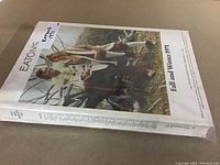 Photo of the front cover of Eaton's 1971 Fall and Winter catalog showing two models outdoors in winter clothing.