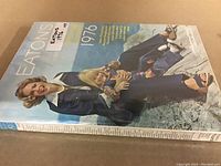 Front cover of Eaton's 1976 catalog showing a woman and child posing outdoors in 1970s clothing.