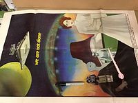 Full view of the Star Wars poster showing main characters including Princess Leia, Darth Vader, R2-D2, and C-3PO against a starry background with a large Imperial Star Destroyer and planet. Text reads 'we are not alone'.