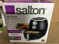 Front view of the Salton air fryer box showing the air fryer image and branding with capacity and oil-free frying claim.