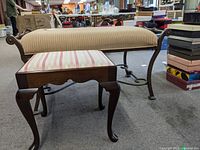 Side view of wood stool and upholstered accent bench showing upholstery fabrics, wood and metal frames