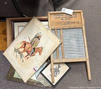 Overview of lot including multiple framed prints and wooden washboard with zinc surface