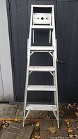 Front view of the 6ft metal step ladder showing steps, platform, and structure.