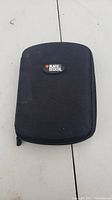 Closed Black & Decker branded soft zippered black carrying case with slight surface wear visible.