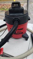Photo showing top view of the Shop Vac vacuum cleaner with hose attached.
