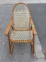 Front view showing full oak frame and rawhide seat weave