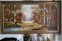 Full front image of the framed oil painting showing a forest clearing with a lake and pathway.