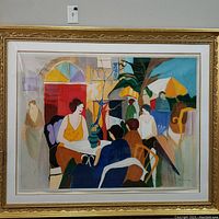 Front view of framed color lithograph showing entire café scene