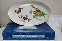 Single oval serving dish with corn and oranges design on top of original blue box labeled 'Royal Worcester Oven to Tableware'.