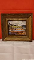 Front view of the framed Tom Thomson print showing the artwork and frame condition.